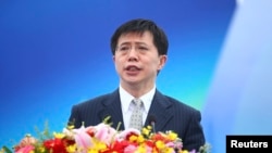 FILE - Ji Wenlin, then mayor of Haikou city, speaks at the opening ceremony of a yatch race in Haikou, Hainan province.