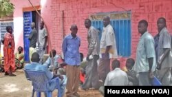 South Sudanese returnees wait to pick up free national ID cards at Apada camp near Aweil in Northern Bahr el Ghazal on Tuesday, March 26, 2013. 