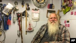 Danny Rice, 67, discusses the coronavirus in his auto repair shop in downtown Elmwood, Neb., Nov. 9, 2020. Rice has continued his life as normal during the pandemic, even though he recognizes that the virus is potentially dangerous for high-risk people.