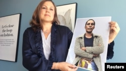 H&M Foundation Global Manager Diana Amini poses with portraits of women on its Foundation 500 list of female entrepreneurs in emerging markets in Stockholm, Sweden, June 2, 2017.