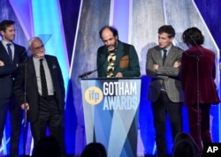 Director Luca Guadagnino (C) accepts the best feature award for "Call Me By Your Name" at the 27th annual Independent Film Project's Gotham Awards at Cipriani Wall Street on Nov. 27, 2017, in New York.