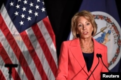 FILE - Education Secretary Betsy DeVos speaks at George Mason University, in Arlington, Virginia, Sept. 7, 2017.