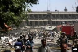 Security forces inspect near the site of an explosion where German Embassy is located in Kabul, Afghanistan, May 31, 2017. A massive explosion rocked a highly secure diplomatic area of Kabul on Wednesday morning, causing casualties and sending up a huge plume of smoke and dust.