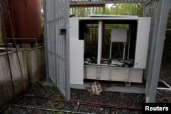 A vandalized backup generator is shown at a Movistar facility in Los Teques, Venezuela, Nov. 21, 2016.