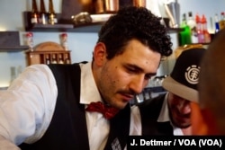 Andrea Oramai Sterpino is so committed to Celleno that he’s opening businesses in the village. He pours drinks at his bar.