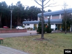 Set in the forest adjacent to a military base, refugees in this camp in Holzdorf, Germany, say they are so isolated that they really don't know if increased European terrorist alerts has sparked xenophobia, Nov. 28, 2015. (VOA News)