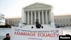 Supporters of gay marriage hold a banner as they rally in front of the Supreme Court in Washington, March 27, 2013.
