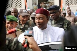 FILE - Niger's President Mahamadou Issoufou speaks to journalists in Niamey, Niger, Feb. 21, 2016.