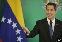 Venezuela's self-proclaimed interim president Juan Guaido speaks during a joint statement with Brazils President Jair Bolsonaro, in Brasilia, Brazil, Feb.28, 2019.
