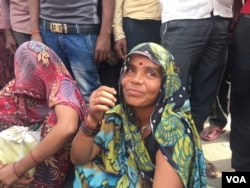 Women are among those looking for work as labor on building projects to supplement family incomes. (A. Pasricha/VOA)