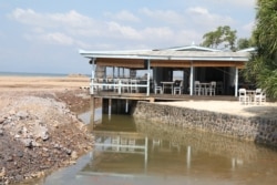 The Sailing Club Bar and Restaurant stands in the middle of a landfill in Kep province, Cambodia, Dec. 27, 2021. (Sun Narin/VOA Khmer)