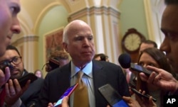FILE - Sen. John McCain, R-Ariz., speaks to reporters on Capitol Hill in Washington, Oct. 31, 2017.