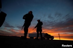 Federal police officers stand guard near the jail where Mexican drug lord Joaquin "El Chapo" Guzman was imprisoned before being extradited to the United States on Thursday, in Ciudad Juarez, Mexico, Jan. 19, 2017.