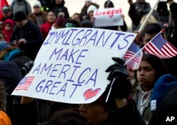 Supporters of immigrants' rights march in downtown Washington during an immigration protest Thursday, Feb. 16, 2017