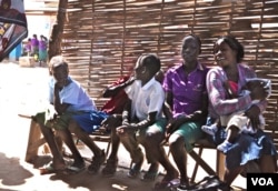 Children wait for their mothers at the Antenatal Clinic in South Sudan. (VOA - H. McNeish)
