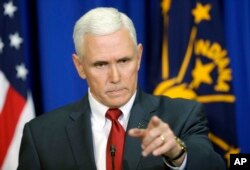 FILE - Indiana Gov. Mike Pence takes a question during a news conference in Indianapolis, March 31, 2015.