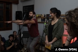 Majd Shidiac, left, at attending one of Poetry Pot events he founded.