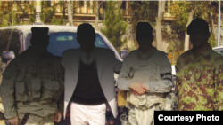 Aimal, second from left, among U.S. and Afghan military personnel in Kabul.