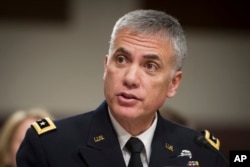 Army Lieutenant General Paul Nakasone appears before the Senate Armed Services Committee to discuss his qualifications as nominee to lead the National Security Agency and U.S. Cyber Command, during a hearing on Capitol Hill in Washington, March 1, 2018.