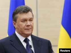 FILE - Ousted Ukrainian President Viktor Yanukovich makes a statement during a news conference in the southern Russian city of Rostov-on-Don, March 11, 2014.