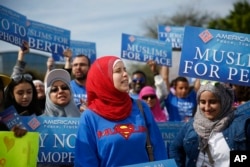 FILE - Protesters stand across the street from a Donald Trump rally in Orlando, Florida.
