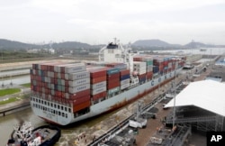 A Panamax cargo vessel navigates the new Cocoli locks during a test of the expanded Panama Canal locks on Pacific side, June 23, 2016. The ship, the largest that can go through the old canal locks, was redirected to the new ones for one more test of the new lock system.