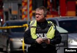 A pedestrian officer responds to an incident where a van struck multiple people at a major intersection in Toronto's northern suburbs in Toronto, Ontario, Canada, April 23, 2018.