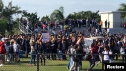 Students walkout at Marjory Stoneman Douglas High School during National School Walkout to protest gun violence in Parkland, Florida, March 14, 2018.