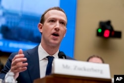FILE - Facebook CEO Mark Zuckerberg testifies before a House Energy and Commerce hearing on Capitol Hill in Washington about the use of Facebook data to target American voters in the 2016 election and data privacy, April 11, 2018.