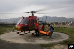 The body of famed Swiss climber Ueli Steck is unloaded from a helicopter at Teaching Hospital in Kathmandu, Nepal, April 30, 2017.