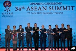 Leaders of the Association of Southeast Asian Nations (ASEAN) pose for a group photo during the opening ceremony of the ASEAN leaders summit in Bangkok, Thailand, June 23, 2019.
