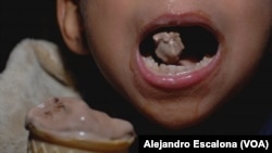 Boy enjoys an ice cream in Montgomery Mall, Bethesda, Maryland. July 15, 2010.