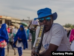 Mohammed, one of the youth vigilantes as part of the Borno Youth Empowerment Scheme, at his post in Monday Market, Maiduguri. (Fati Abubakar)