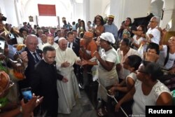 Pope Francis is greeted by faithful during a visit to the Sanctuary of St. Peter Claver, Cartagena, Colombia, Sept. 10, 2017.