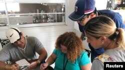 Doctors review prescriptions of patients in a elderly care facility in Orocovis, Puerto Rico, Oct. 3, 2017.
