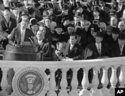 In this Jan. 20, 1961, file photo, President John F. Kennedy gives his inaugural address at the Capitol in Washington