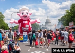A blown up pig welcomes visitors to the National Capital Barbecue Battle in Washington D.C. on Sunday, June 25, 2017.