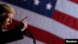 FILE - U.S. President Donald Trump addresses a campaign rally at the Columbia Regional Airport in Columbia, Missouri, Nov. 1, 2018.