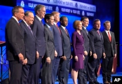 From left, John Kasich, Mike Huckabee, Jeb Bush, Marco Rubio, Donald Trump, Ben Carson, Carly Fiorina, Ted Cruz, Chris Christie and Rand Paul take the stage during the CNBC Republican presidential debate in Boulder, Colo., Oct. 28, 2015.