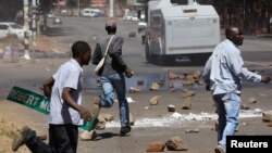 Opposition party supporters clash with police in Harare, Zimbabwe, Aug. 26, 2016.