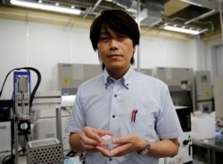Osaka University Professor Michiya Matsusaki shows off cultured Wagyu beef at a lab at the university in Suita, Osaka PrefectureREUTERS/Akira Tomoshige