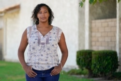 Brooke Aston Harper, whose children are 4 and 6, poses for a photo Monday, July 13, 2020, in Placentia, Calif. She plans to do online distance learning with her 6-year-old when school starts in the fall.
