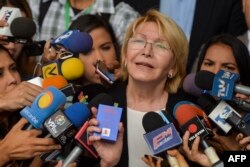 Venezuela's attorney general Luisa Ortega speaks to journalists outside the Supreme Court of Justice headquarters building in Caracas, June 13, 2017.