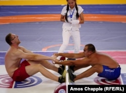Competitors participate in traditional stick wrestling at the 2016 World Nomad Games (RFE/RL)