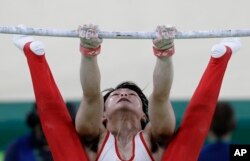 Japan's Kohei Uchimura performs on the horizontal bar during the artistic gymnastics men's team final at the 2016 Summer Olympics in Rio de Janeiro, Brazil, Monday, Aug. 8, 2016.