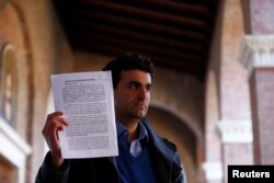 Miguel Hurtado, a survivor of sexual abuse, demonstrates inside the headquarters of Benedictine Order in Rome, Italy, Feb. 22, 2019 during the four-day meeting on the global sexual abuse crisis at the Vatican