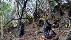 People flee from fighting in Myanmar's northwestern town of Mindat in Chin State, Myanmar, May 17, 2021, in this picture obtained from social media by Reuters. ATTENTION EDITORS - THIS IMAGE HAS BEEN SUPPLIED BY A THIRD PARTY. NO RESALES. NO ARCHIVES.