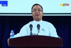 This screengrab provided via AFPTV and taken from a broadcast by Myanmar Radio and Television (MRTV) in Myanmar on April 9, 2021 shows junta spokesman Brigadier General Zaw Min Tun speaking during a live press conference organised by the military governme