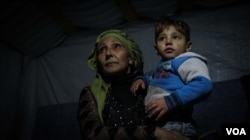 Mother of eight Najah Ali has been living in the camp for two years. Her husband died in Syria and she struggles to provide for her family - she cannot afford fuel for a heater. (John Owens for VOA)