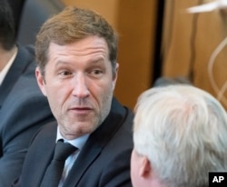 FILE - Minister-President of Wallonia, Paul Magnette, attends a session in the Walloon Parliament in Namur, Belgium, Oct. 28, 2016.